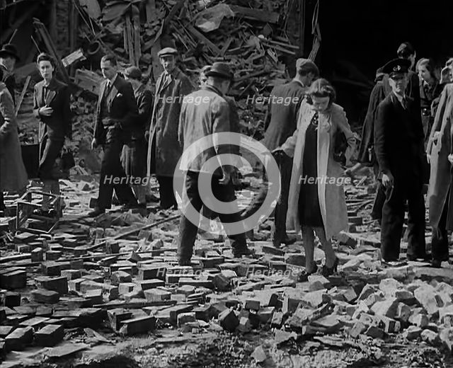 Crowds Walking Past Bombed Out Buildings, 1940. Creator: British Pathe Ltd.