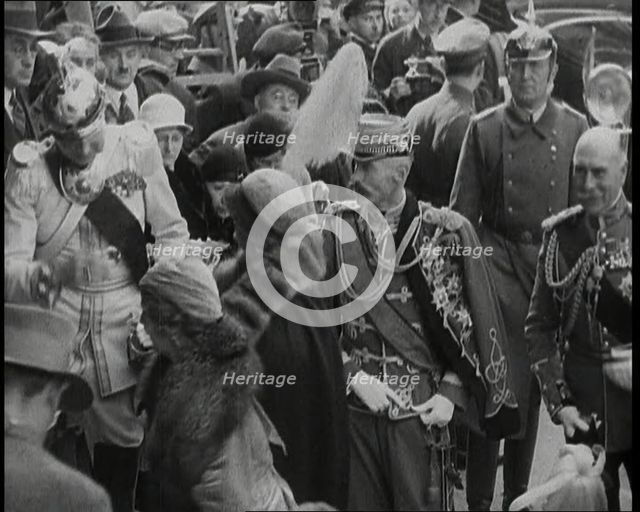 Crowds Watching a Group of Well Dressed People, 1930s. Creator: British Pathe Ltd.