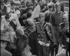 Crowds Watching a Group of Well Dressed People, 1930s. Creator: British Pathe Ltd