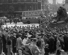 Crowds Watching a Military Band March in Trafalgar Square, 1940. Creator: British Pathe Ltd