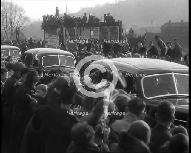 Crowds Watching a Parade of Cars, 1936. Creator: British Pathe Ltd.