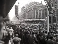 Crowds watching the coronation procession of Queen Elizabeth II, Oxford Street, London, 2 June 1953. Creator: Arthur Charles Kirby Ware