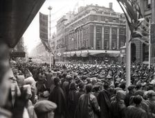 Crowds watching the coronation procession of Queen Elizabeth II, Oxford Street, London, 2 June 1953. Creator: Arthur Charles Kirby Ware