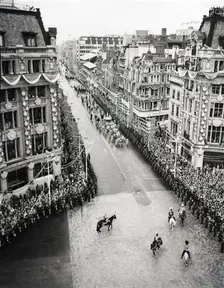 Crowds watching the coronation procession of Queen Elizabeth II, Oxford Circus, London, 2 June 1953. Creator: Arthur Charles Kirby Ware