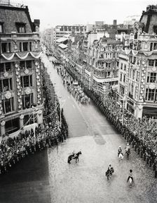Crowds watching the coronation procession of Queen Elizabeth II, Oxford Circus, London, 2 June 1953. Creator: Arthur Charles Kirby Ware