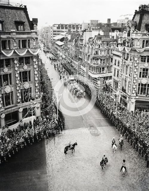 Crowds watching the coronation procession of Queen Elizabeth II, Oxford Circus, London, 2 June 1953. Creator: Arthur Charles Kirby Ware.