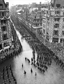 Crowds watching the coronation procession of Queen Elizabeth II, Oxford Circus, London, 2 June 1953. Creator: Arthur Charles Kirby Ware