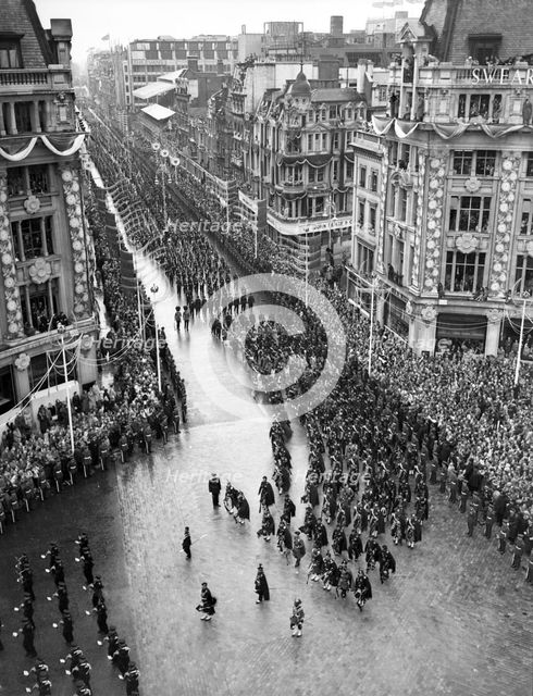 Crowds watching the coronation procession of Queen Elizabeth II, Oxford Circus, London, 2 June 1953. Creator: Arthur Charles Kirby Ware.