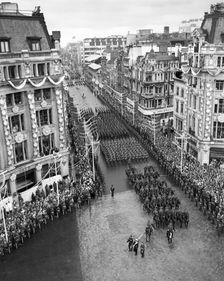 Crowds watching the coronation procession of Queen Elizabeth II, Oxford Circus, London, 2 June 1953. Creator: Arthur Charles Kirby Ware