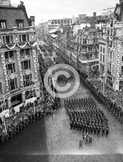 Crowds watching the coronation procession of Queen Elizabeth II, Oxford Circus, London, 2 June 1953. Creator: Arthur Charles Kirby Ware.