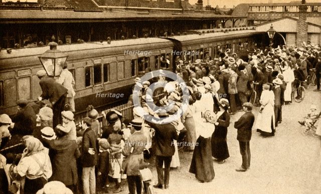 Crowds waving off troops leaving to fight in the First World, War, Britain, 1914, (1933). Creator: Unknown.