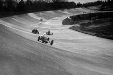 CS Staniland's Bugatti Type 37A leading a Benz and Jack Dunfee's Ballot, Brooklands, 1930. Artist: Bill Brunell