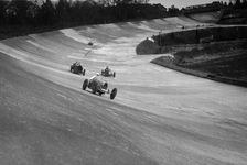 CS Staniland's Bugatti Type 37A leading a Benz and Jack Dunfee's Ballot, Brooklands, 1930. Artist: Bill Brunell