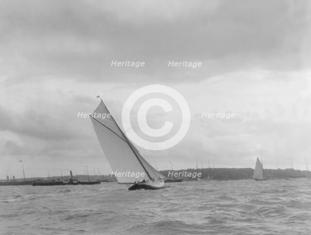 Cutter heeling hard on upwind leg. Creator: Kirk & Sons of Cowes.