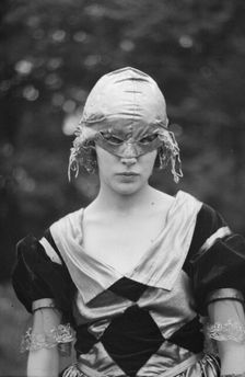 Cutter, Helen, Miss, wearing a mask, 1921 or 1922. Creator: Arnold Genthe