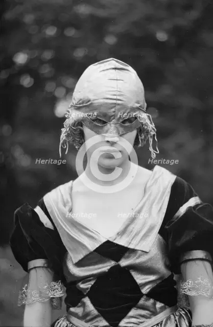 Cutter, Helen, Miss, wearing a mask, 1921 or 1922. Creator: Arnold Genthe.