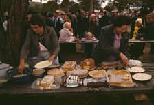 Cutting the pies and cakes at the barbeque dinner, Pie Town, New Mexico Fair, 1940. Creator: Russell Lee