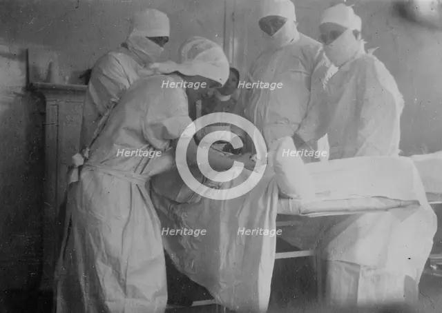 Cutting off a foot -- Canadian Hospital, Le Touquet, between 1914 and c1915. Creator: Bain News Service.