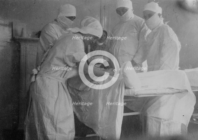 Cutting off a foot -- Canadian Hospital, Le Touquet, between 1914 and c1915. Creator: Bain News Service.
