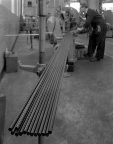 Cutting steel rods to length, Park Gate Iron & Steel Co, Rotherham, South Yorkshire, 1964. Artist: Michael Walters