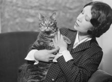 Cumner, Gwendolyn, Miss, with cat (possibly Pudge), portrait photograph, 1928 Creator: Arnold Genthe