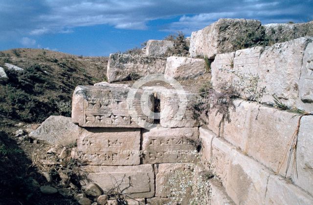Cuneiform inscriptions on stones, ruined aqueduct, Jerwan, Iraq, 1977.