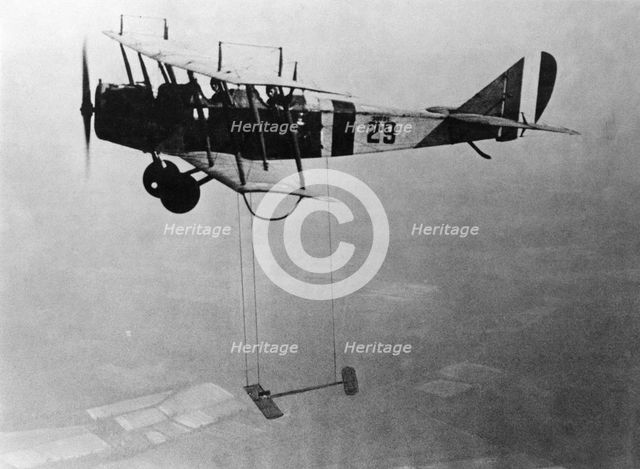 Curtiss JN-4 "Jenny" aircraft with model wing suspended, June 22, 1921. Creator: Unknown.