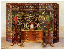 Curved commode table and Chinese lacquered eight fold screen, 1911-1912.Artist: Edwin Foley