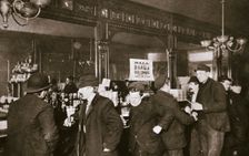 Customers drinking in a bar in the Bowery, New York City, USA, 1900s. Creator: Unknown