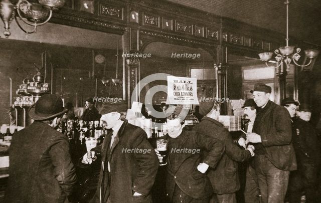 Customers drinking in a bar in the Bowery, New York City, USA, 1900s. Creator: Unknown.