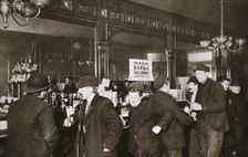 Customers drinking in a bar in the Bowery, New York City, USA, 1900s