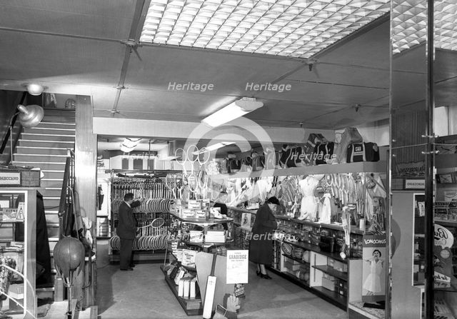 Customers in the Barnsley Co-op's sports department, South Yorkshire, 1957. Creator: Michael Walters.