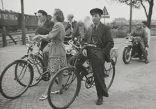 Cyclists by a level crossing, Landskrona, Sweden, 1950. Creator: Unknown