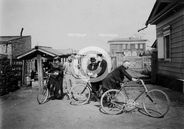 Cyclists in the courtyard of the estate, 1900. Creators: V. I. Podgorbunskii, I. A. Podgorbunskii.