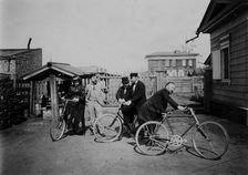 Cyclists in the courtyard of the estate, 1900. Creators: V. I. Podgorbunskii, I. A. Podgorbunskii