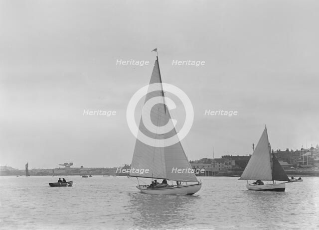 A 5 ton sloop, possibly 'Armonelle', under sail, 1921. Creator: Kirk & Sons of Cowes.