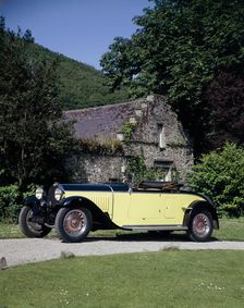 A 1934 Bugatti Type 46 outside a cottage