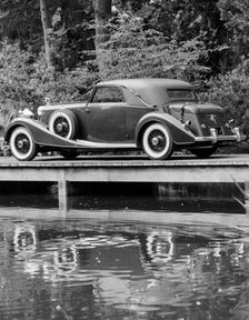 A 1933 Hispano-Suiza K6 reflected in a lake