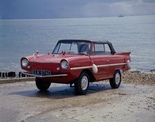 A 1965 Amphicar at the water's edge