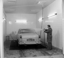 A 1961 Austin Westminster in a car wash, Grimsby, 1965. Creator: Michael Walters