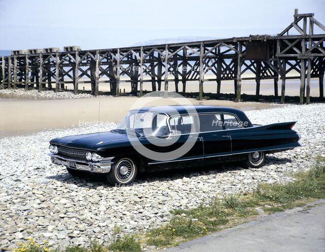 A 1961 Cadillac Presidential limousine on a beach. Artist: Unknown