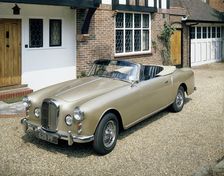 A 1963 Alvis car parked on a gravel driveway