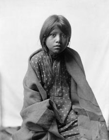 A Taos girl, three-quarter length portrait, seated, facing front, c1905. Creator: Edward Sheriff Curtis