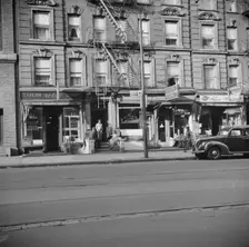 A tenament house in Harlem, New York, 1943. Creator: Gordon Parks