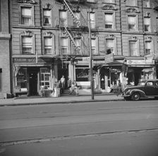 A tenament house in Harlem, New York, 1943. Creator: Gordon Parks