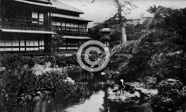 'A tea-house garden, Tokyo. Landscape gardening with theme of volcanic origins', c1900, (1921). Artist: Julian Leonard Street.