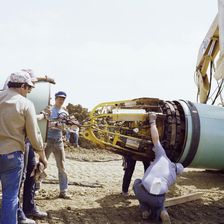 A team of men joining two steel pipes together on the Martin pipeline, Hertfordshire, 07/07/1981. Creator: John Laing plc