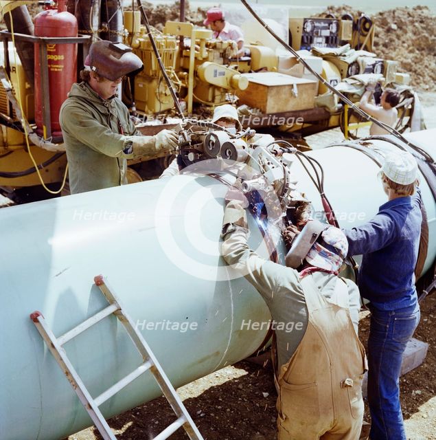 A team of welders working on the Martin pipeline, Hertfordshire, 07/07/1981. Creator: John Laing plc.