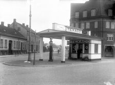 A Texaco petrol pump in a built-up area, Landskrona, Sweden, 1930 Creator: Unknown