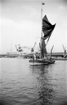A Thames sailing barge in the Royal Albert Dock, Canning Town, London, c1945-c1965. Artist: SW Rawlings